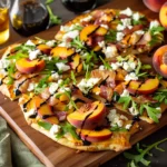 Peach Flatbread With Goat Cheese Arugula Prosciutto and Balsamic Glaze