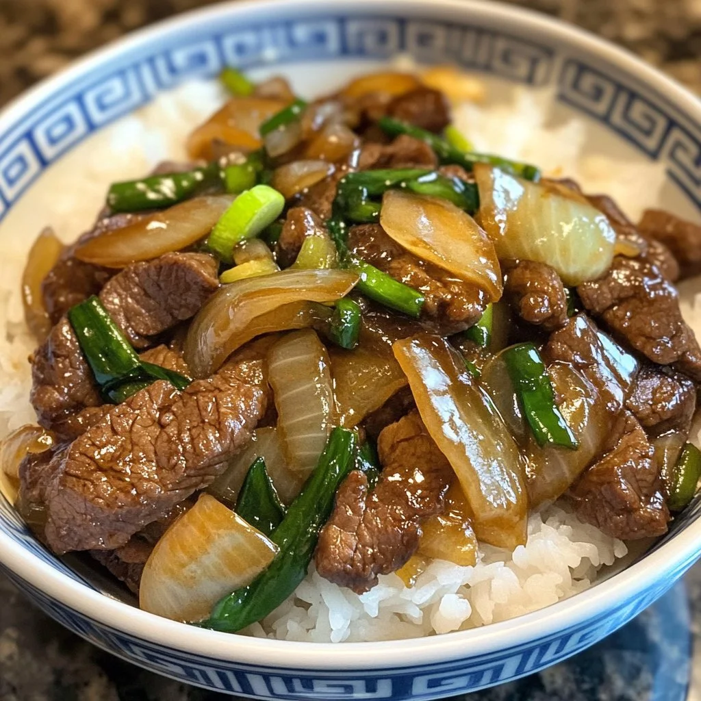 Delicious Chinese beef and onion stir fry served in a bowl