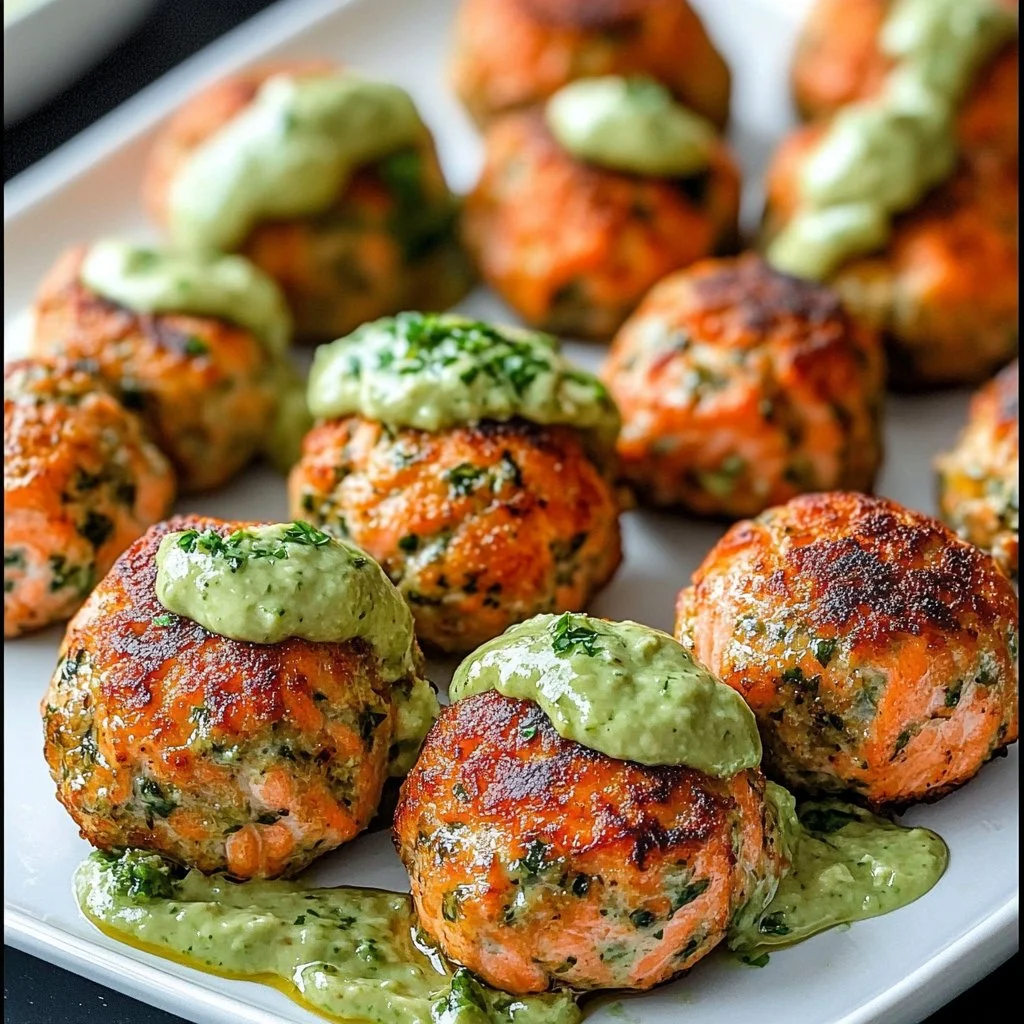 Baked salmon meatballs with avocado sauce on a plate