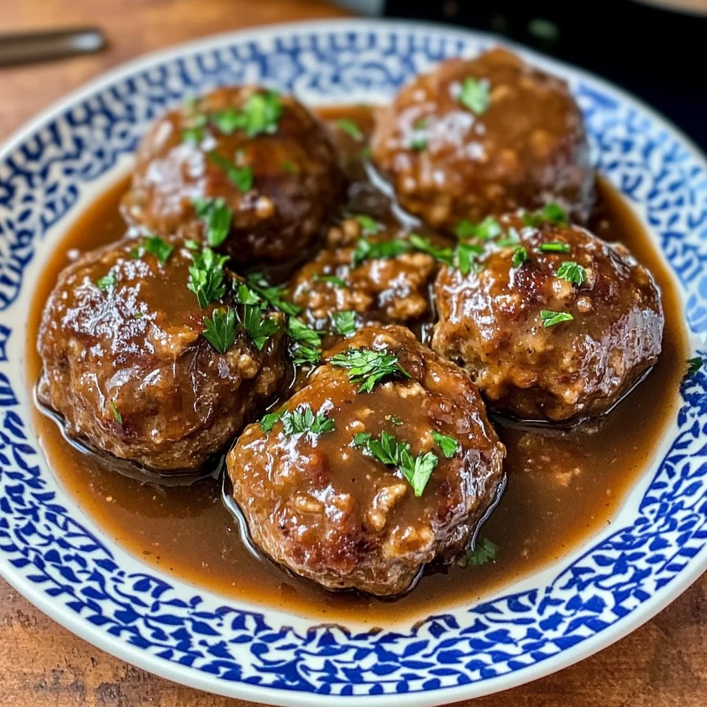 Savory Salisbury steak meatballs served with mashed potatoes and gravy.