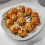 Bacon jalapeño popper cheese balls garnished and ready to serve