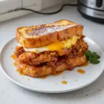 Crispy French toast fried chicken sandwich on a plate