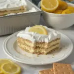 No-Bake Lemon Icebox Cake with fresh lemon slices and whipped cream topping