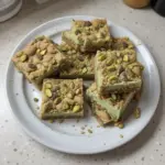 Delicious pistachio cookie bars topped with nuts and perfect for dessert